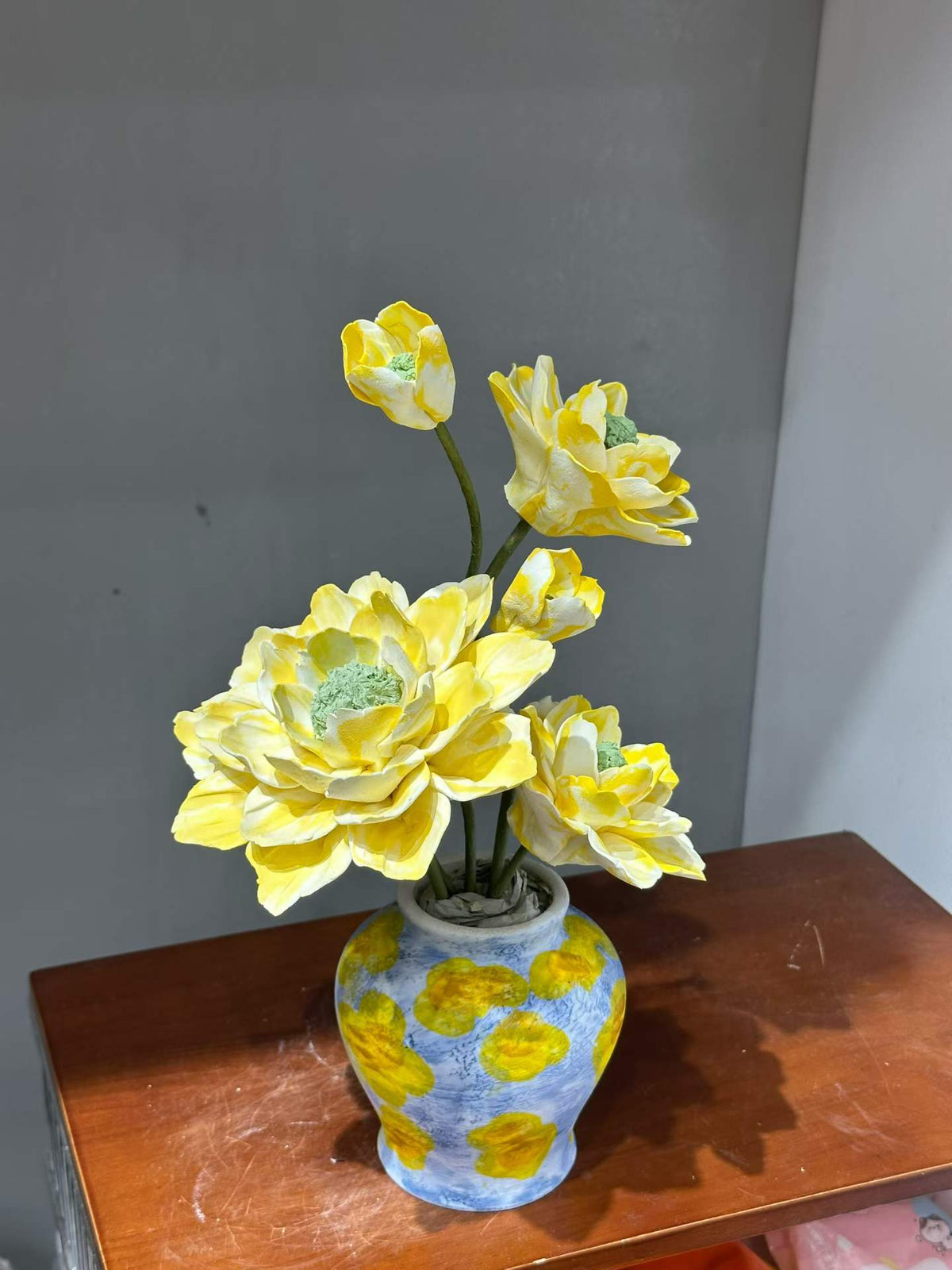 Yellow Porcelain Flowers with Patterned Vase