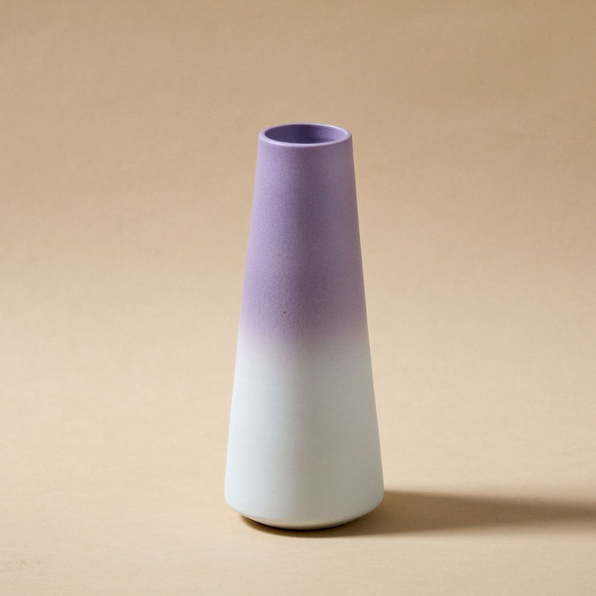 Lavender-to-white gradient tapered ceramic vase with a frosted finish.