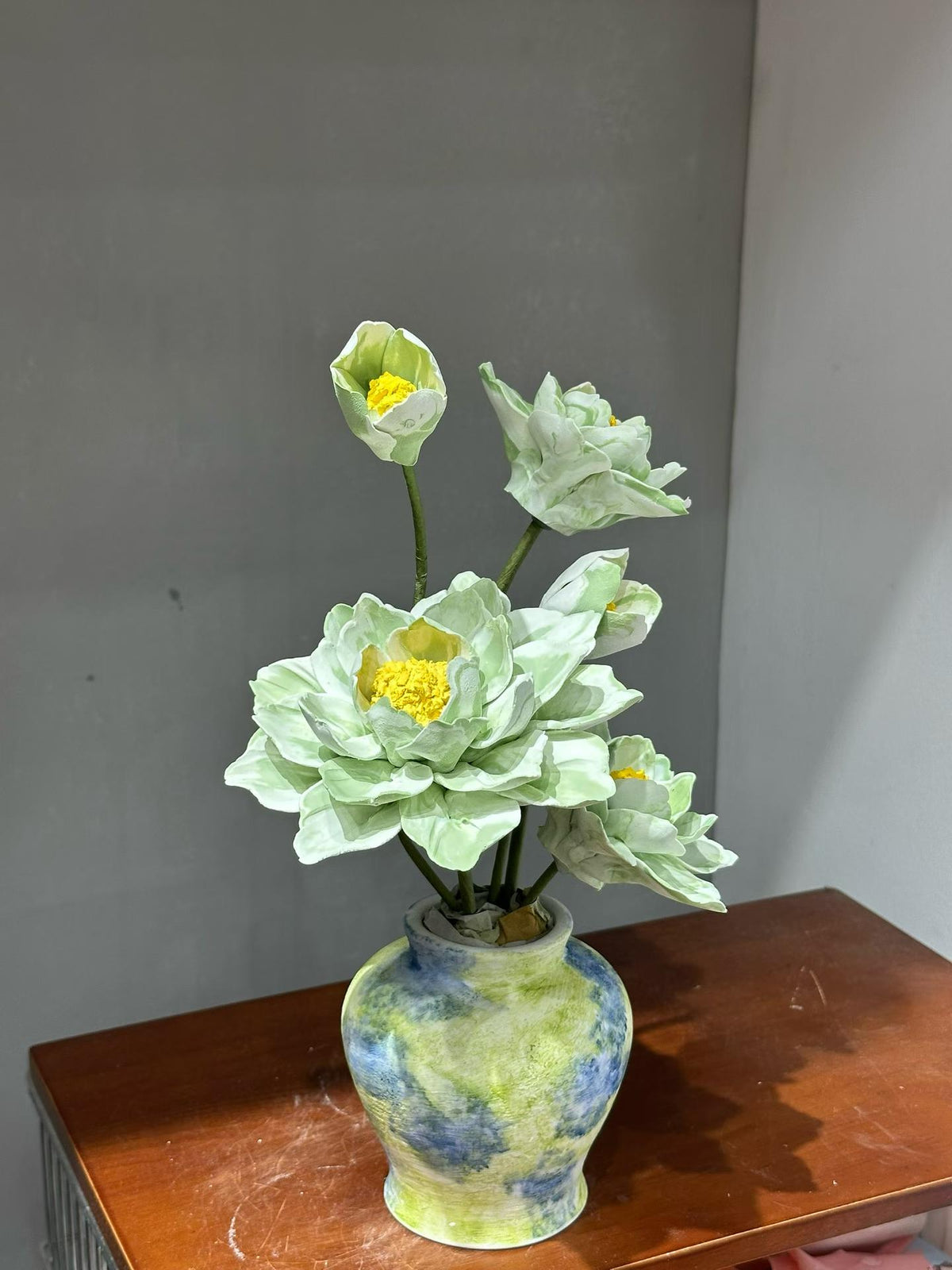 Soft Green Porcelain Flowers with Patterned Vase